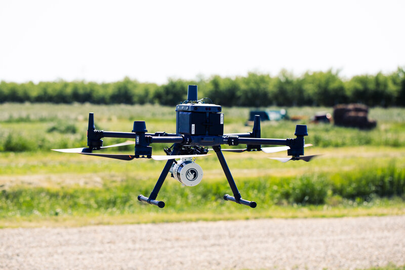 Mapping drone in flight over the farm